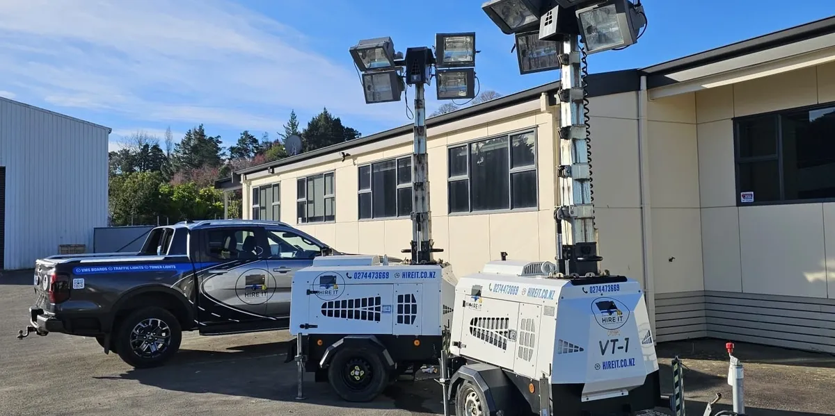 Portable tower lighting illuminating construction sites at night